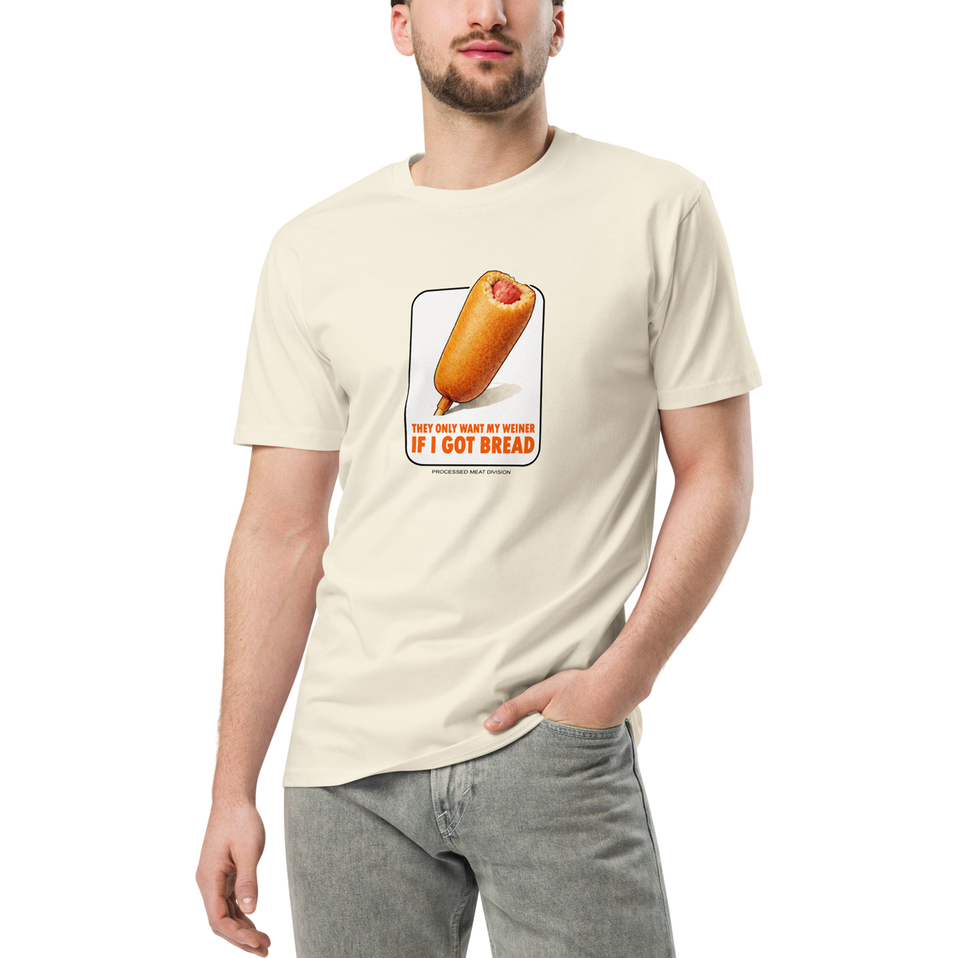 Person wearing a cream t-shirt with a corn dog graphic and text on a white background