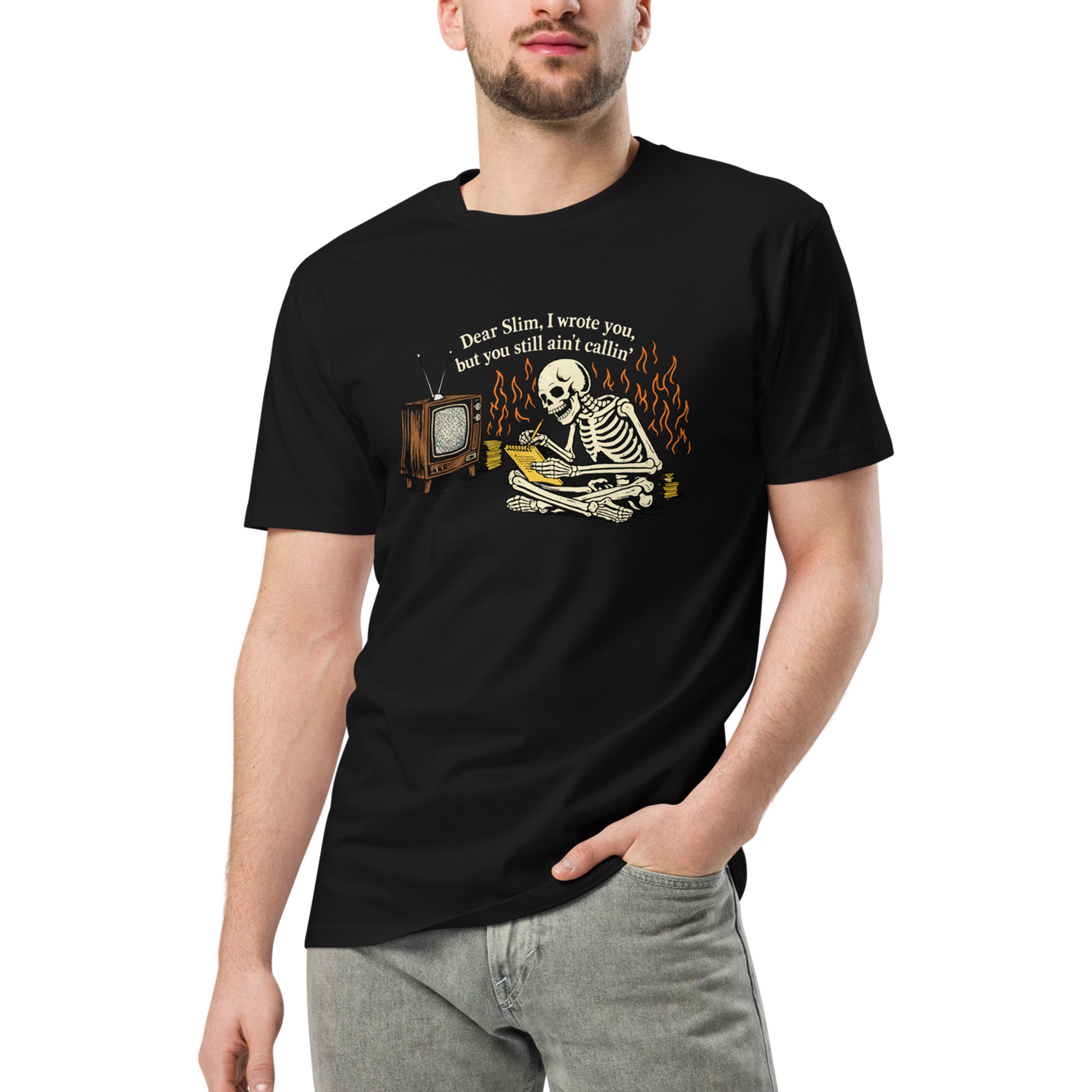 Person wearing a black t-shirt with a skeleton and vintage television graphic.