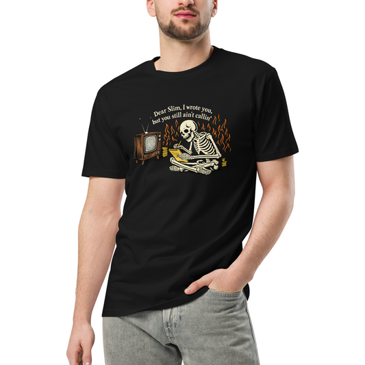 Person wearing a black t-shirt with a skeleton and vintage television graphic.