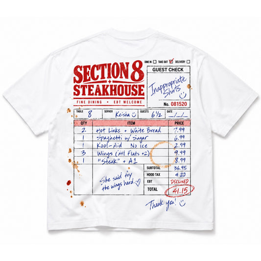 A white short-sleeve graphic t-shirt featuring a printed guest check receipt design from 'Section 8 Steakhouse' with red and black text, handwritten-style blue ink notes, and red sauce splatter details.